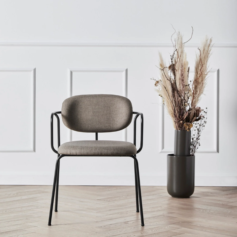 The Frame Dining Chair from Woud in a living space.