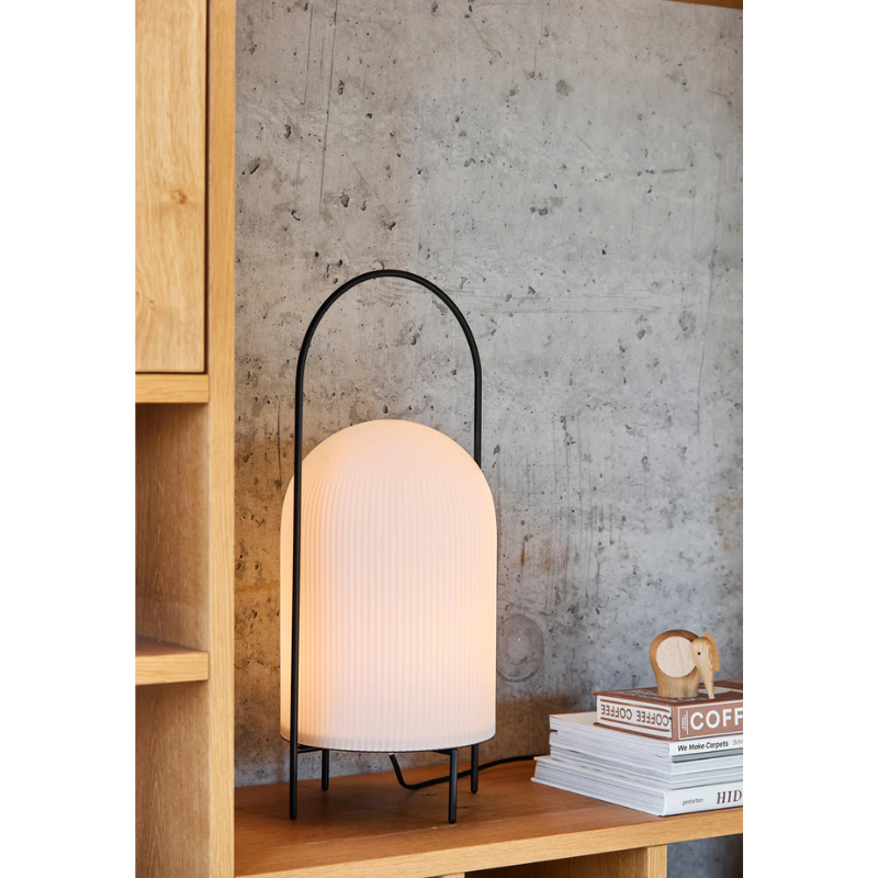 The Ghost Table Lamp from Woud in a close up lifestyle photograph.