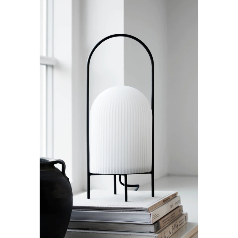 The Ghost Table Lamp from Woud in a living room.