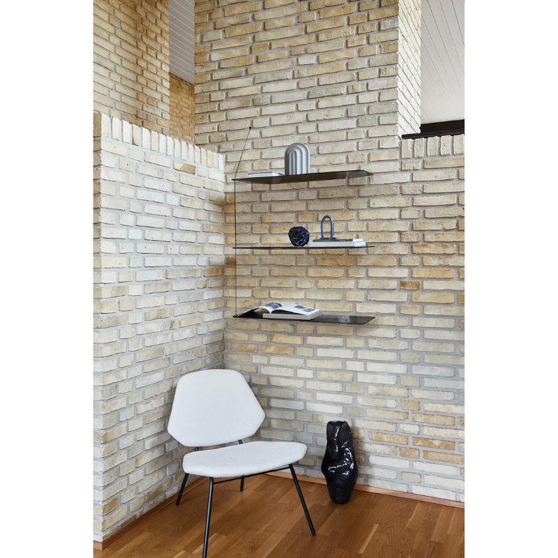 The Lean Lounge Chair from Woud in a family space.