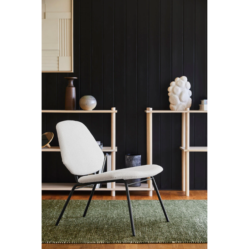 The Lean Lounge Chair from Woud in a living room.
