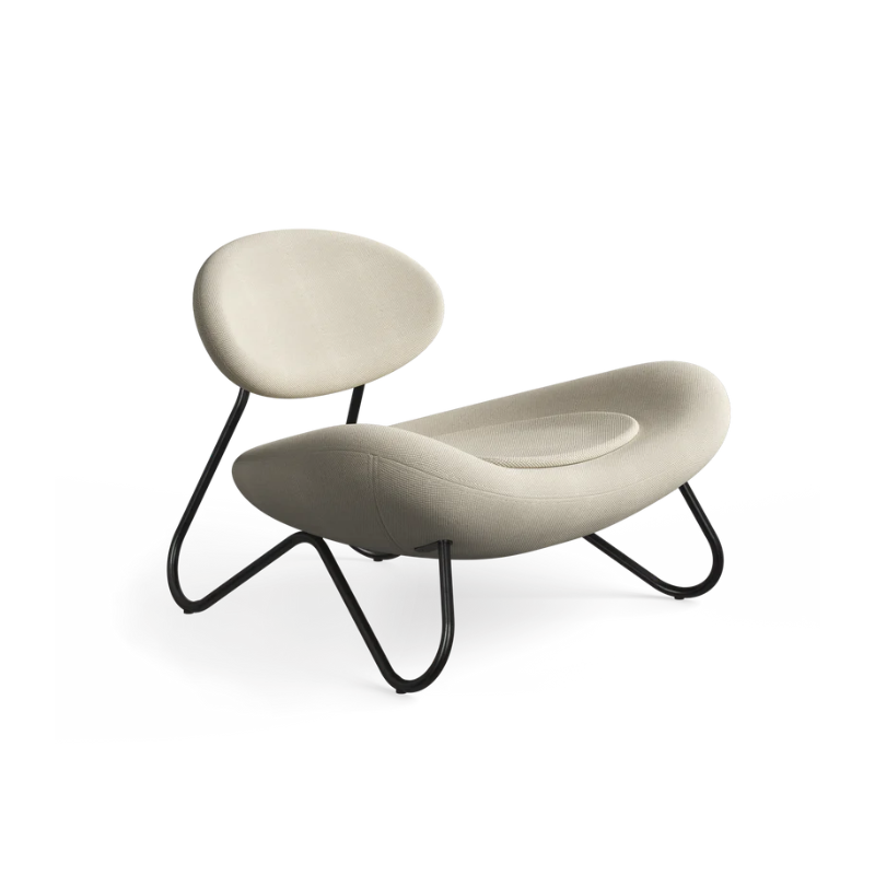 The Meadow Lounge Chair from Woud with off white/grey fabric and black legs.
