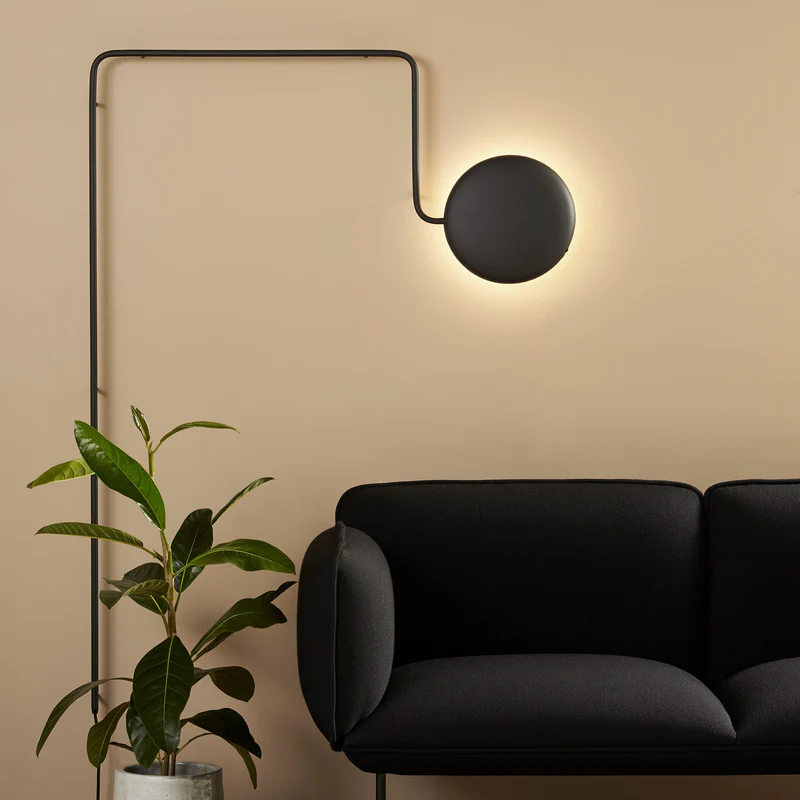The Mercury Wall Lamp from Woud in a living room.