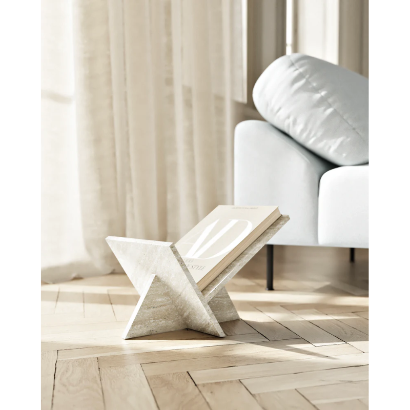 The Mountain Magazine Holder from Woud in a lifestyle shot, showcasing it being used within a living room.