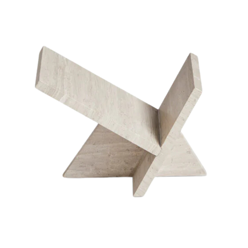 The Mountain Paperweight, a solid travertine piece by Woud from a side angle.