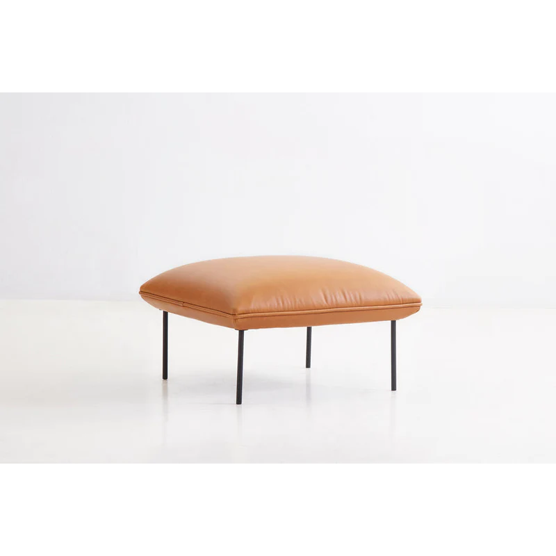 The Nakki Ottoman from Woud with a custom fabric in a lounge.