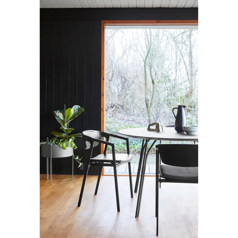 A Pidestall Planter in a dining room.