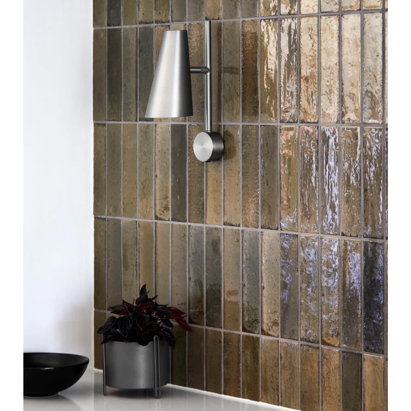 The small Pidestall Planter in black on a counter top.