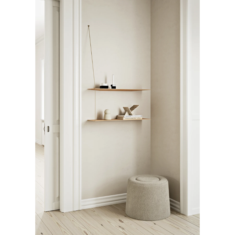 The Praline Pouf from Woud in a family area.