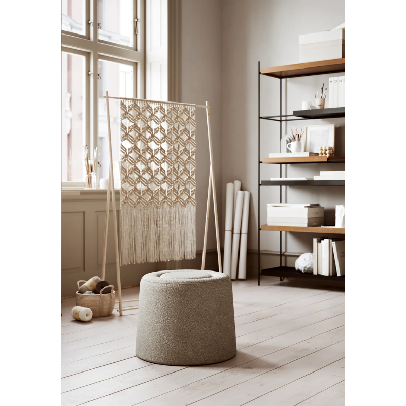 The Praline Pouf from Woud in a living room.