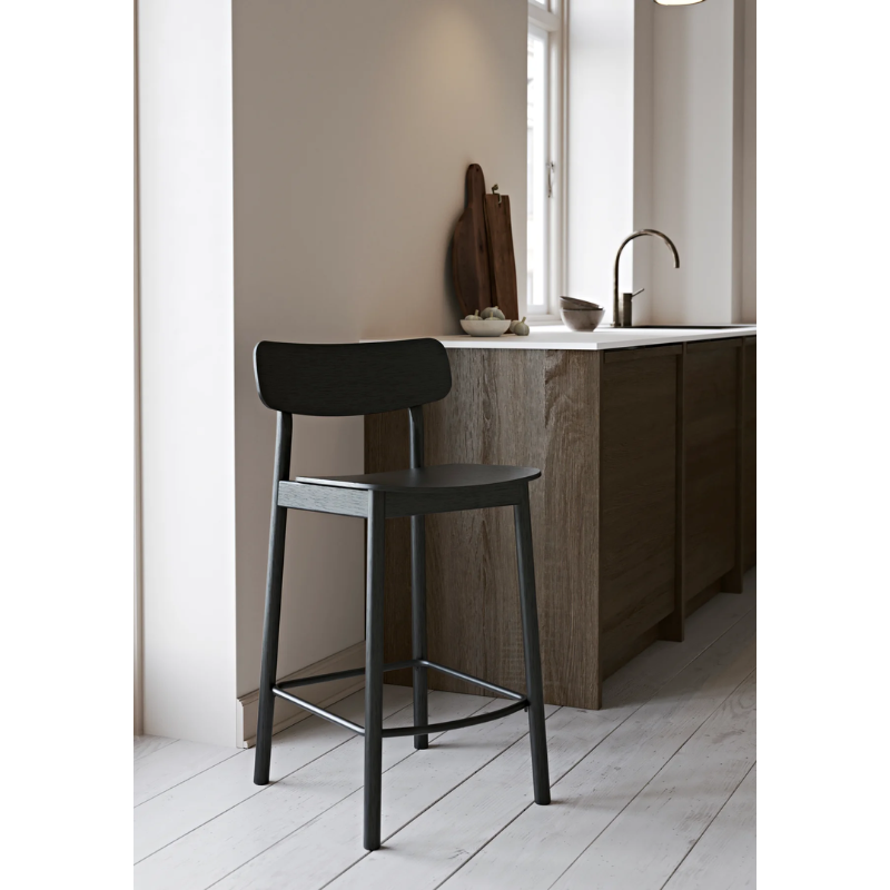 The Soma Counter Chair from Woud in a kitchen close up shot.