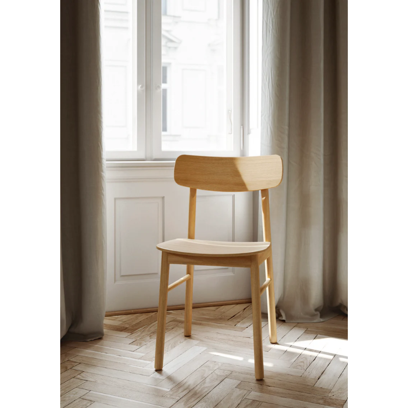 The Soma Dining Chair from Woud in Oiled Oak.