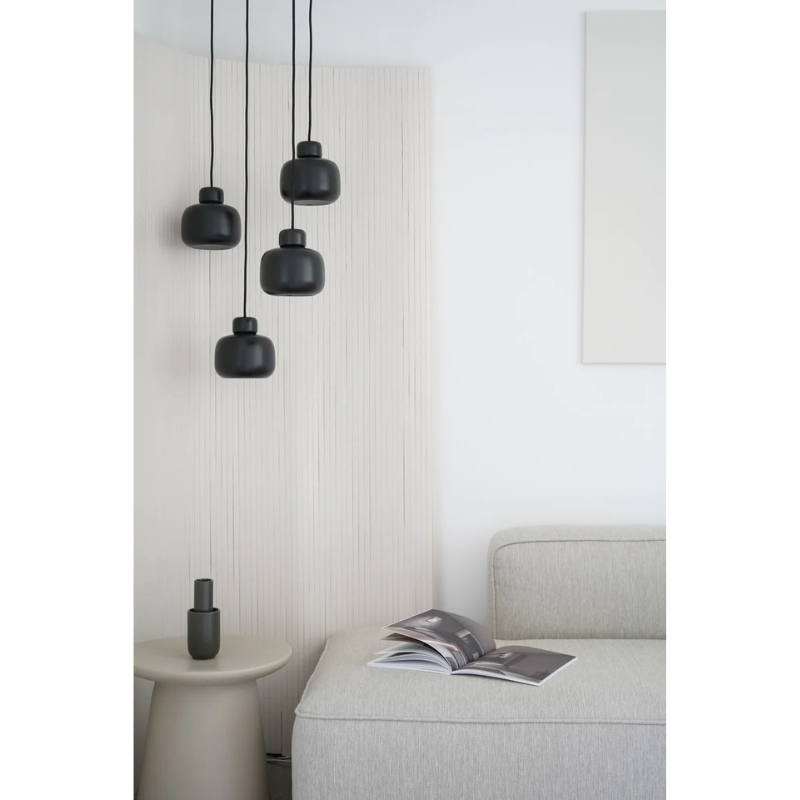 The Stone Pendant from Woud in a living room.