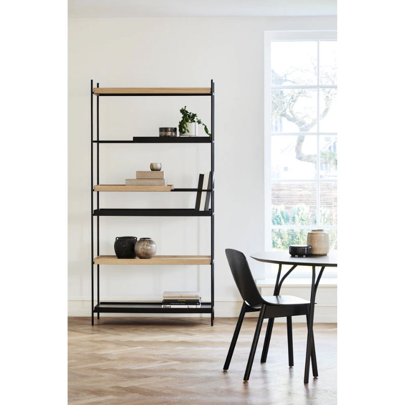 The Tray Shelf from Woud being used in a dining room.