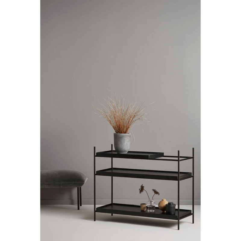 The low oak Tray Shelf from Woud in a family space.