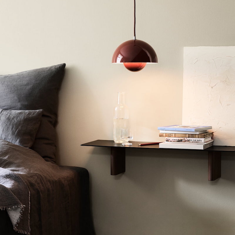 A lifestyle shot within a bedroom, showcasing the FlowerPot VP1. Shop for your new bedroom furniture and lighting today at illuminee.com.