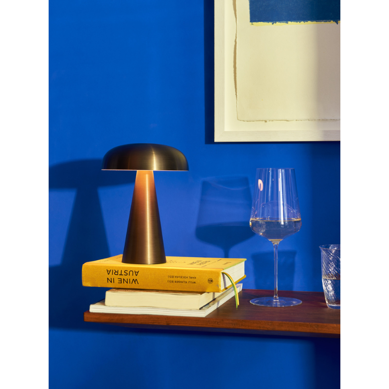 The Como SC53 from &Tradition in bronzed in a living room.