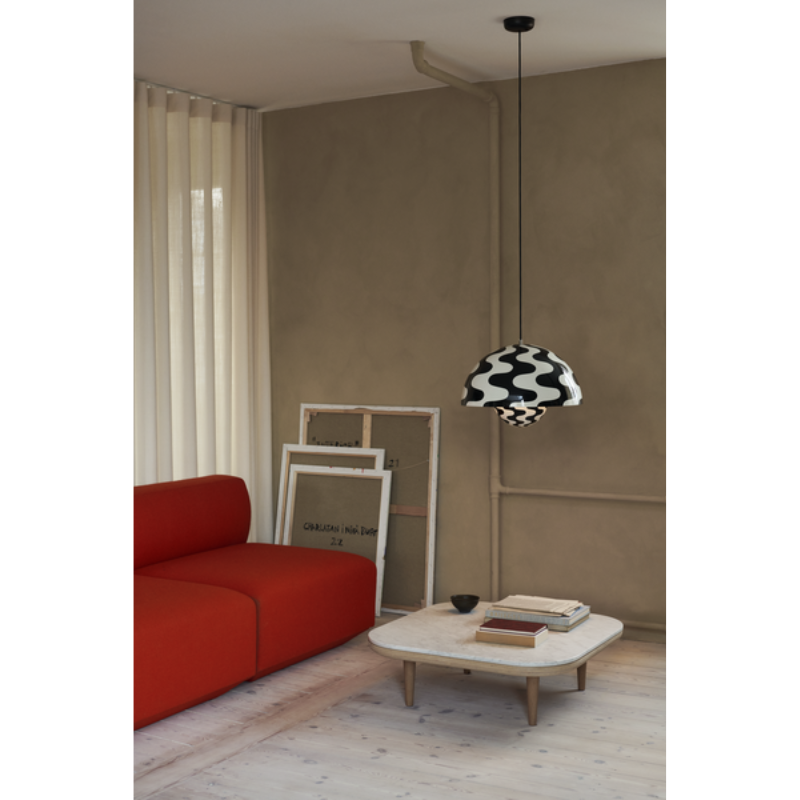The Flowerpot VP2 Pendant Light from &Tradition in a lounge.