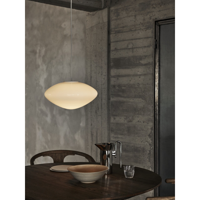 The Mist Pendant from &Tradition in a dining room.
