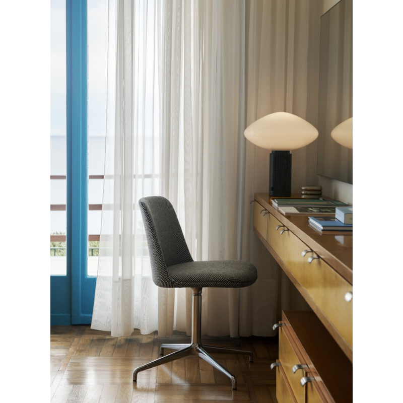 The Mist Table Lamp from &Tradition in a bedroom.