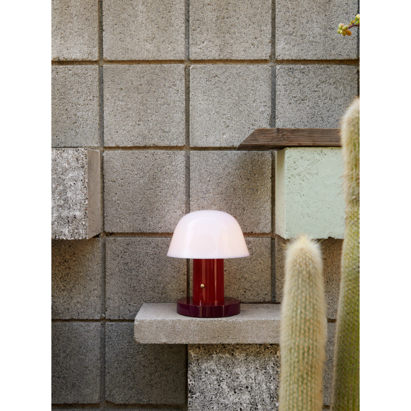 The Setago Portable Lamp from &Tradition in a living room.