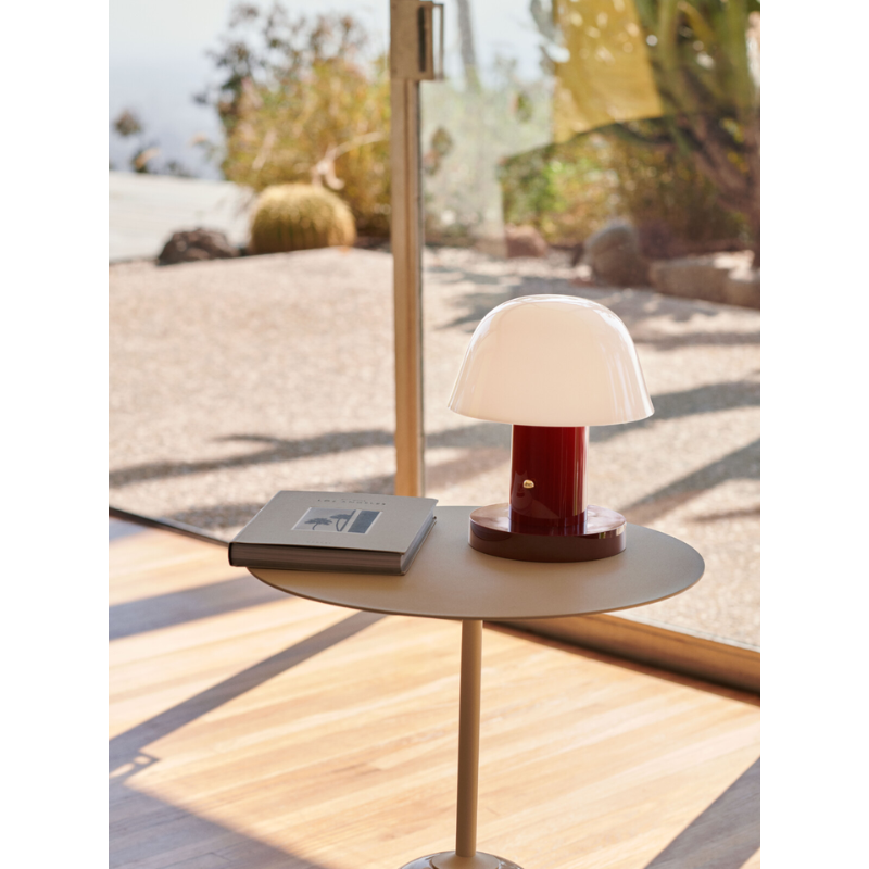 The Setago Portable Lamp from &Tradition in a lounge.