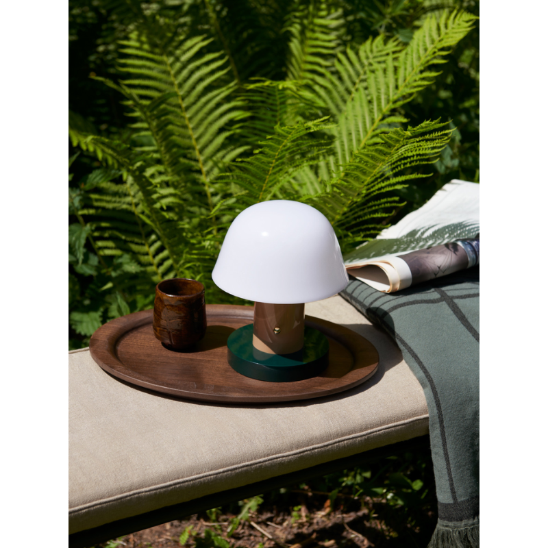 The Setago Portable Lamp from &Tradition outdoors.