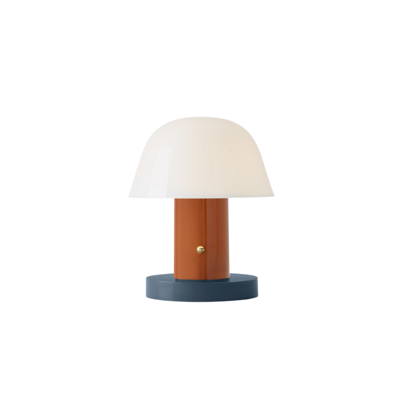 The Setago Portable Lamp from &Tradition in rust and thunder.