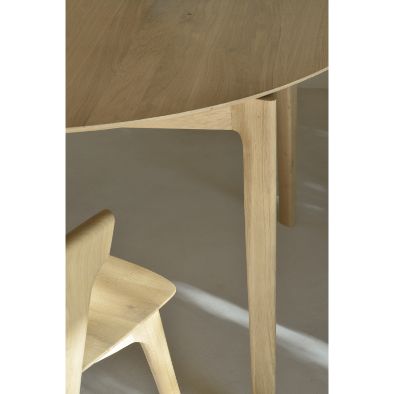 The Round Bok Extendable Dining Table from Ethnicraft close-up in a lifestyle shot.