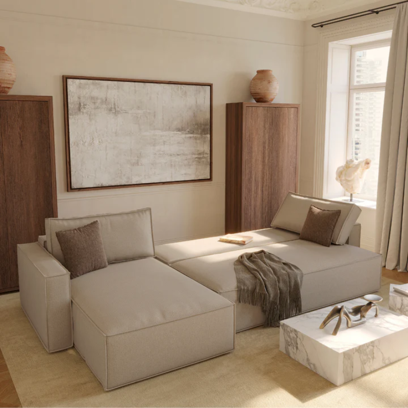 The Newilla sectional sleeper sofa with lounger converted in living room