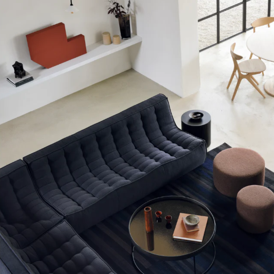 A living room lifestyle shot featuring the N701 Sofa from Ethnicraft, sold at Illuminee. Make your living room more comfortable today, and shop our living room collection.