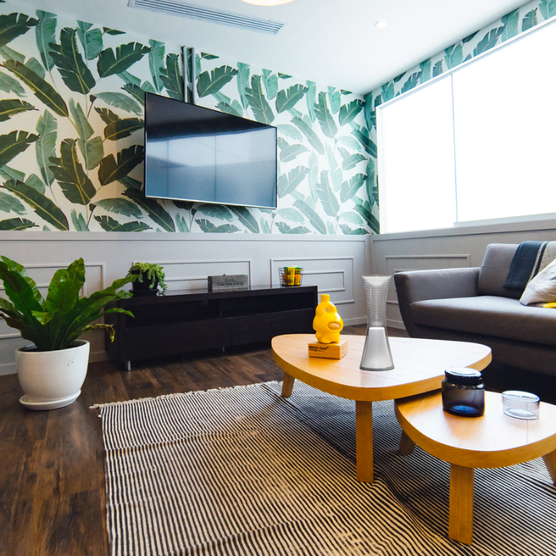 The Come Together Portable Lamp from Artemide in white in a lounge.