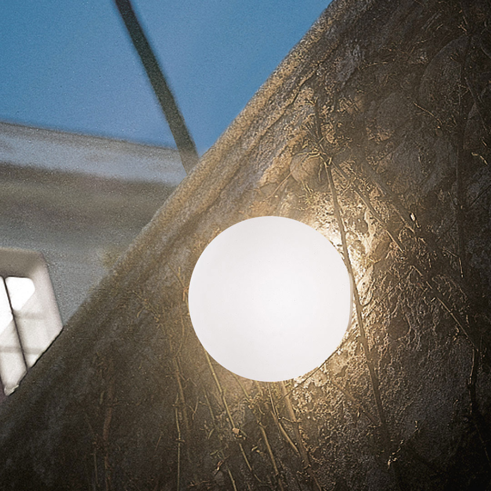 The Dioscuri Wall / Ceiling Light from Artemide in the size large installed outside.