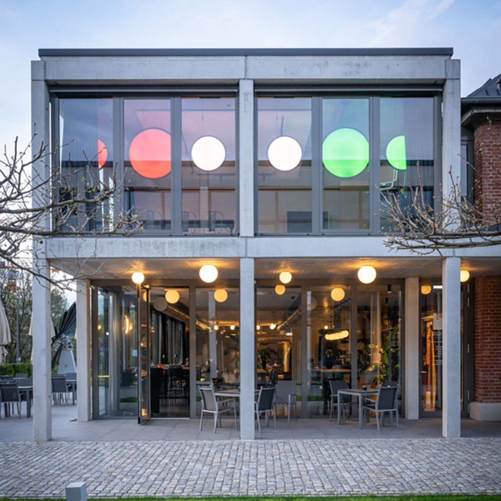 The Dioscuri Wall / Ceiling Light from Artemide in the size large installed on the ceiling of a restaurant.