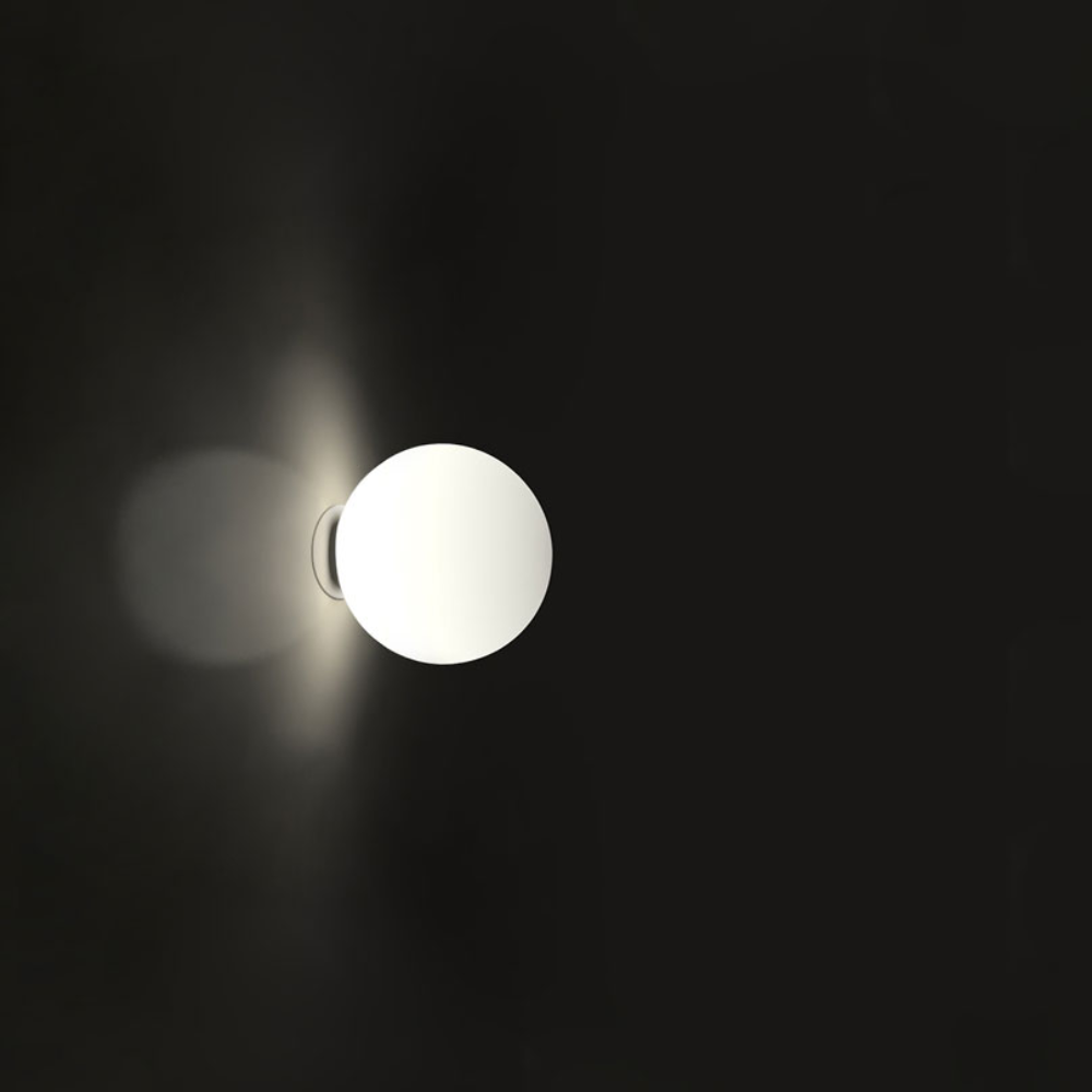 The Dioscuri Wall / Ceiling Light from Artemide in the size medium turned on.