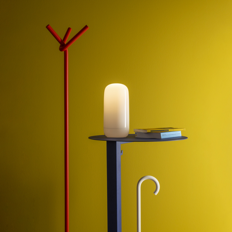 The Gople Portable Lamp from Artemide in a living room.