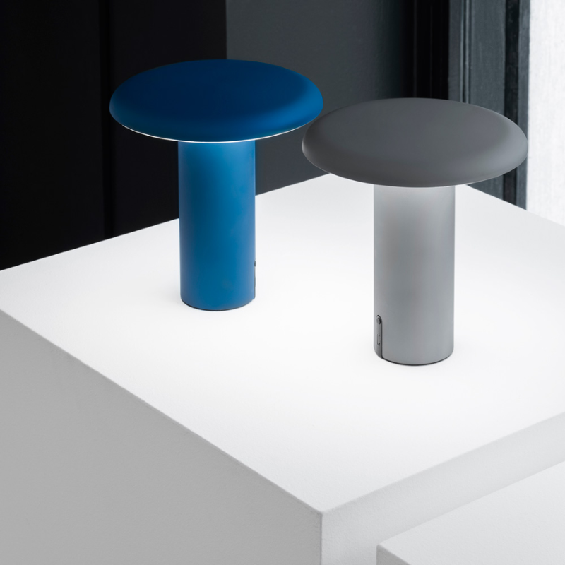 The Takku Portable Lamp from Artemide in a studio.