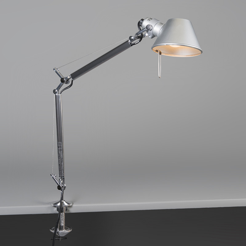 The Tolomeo Micro Table Lamp from Artemide in aluminum with the table clamp and traditional socket.