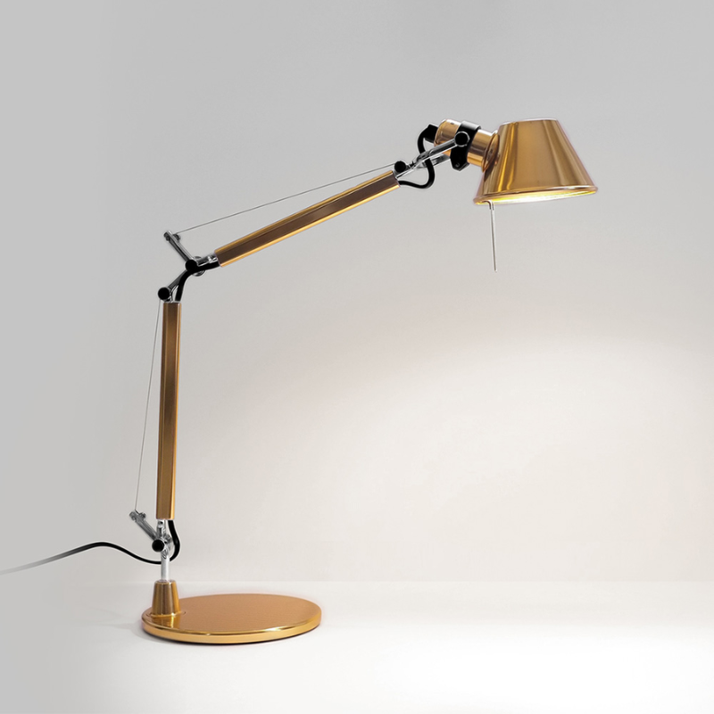 The Tolomeo Micro Table Lamp from Artemide in gold with the table base.