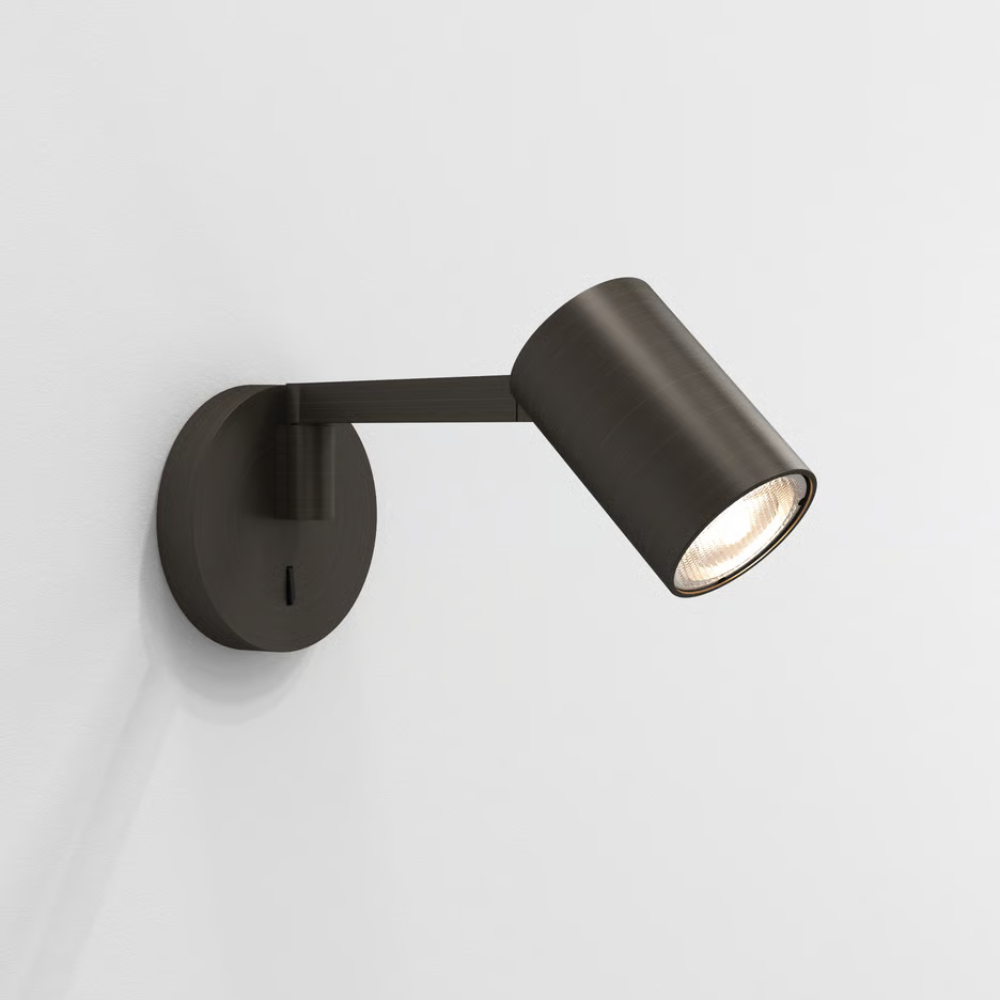 The bronze Ascoli Swing Reading Light from Astro Lighting in a living area.