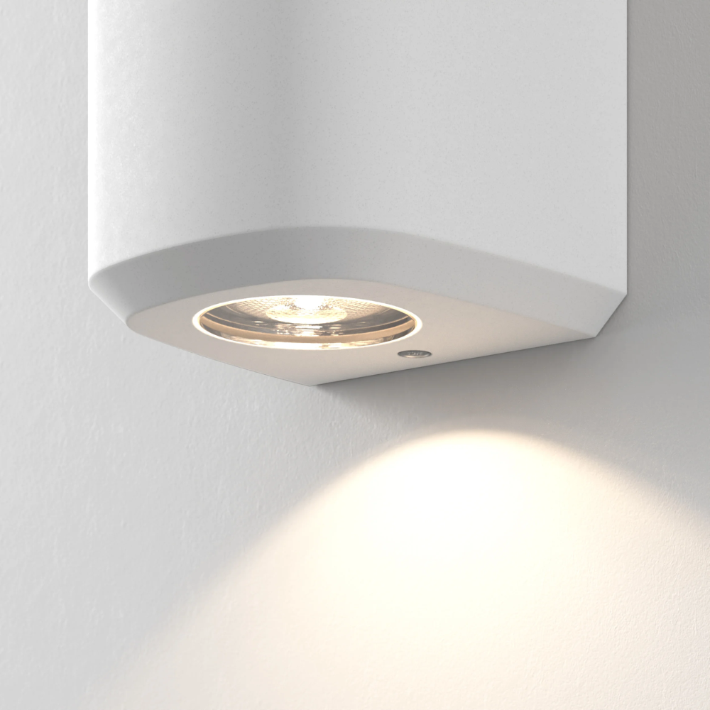 Close up of the light source of the Brixham Wall Single outdoor sconce in white concrete by Astro Lighting.