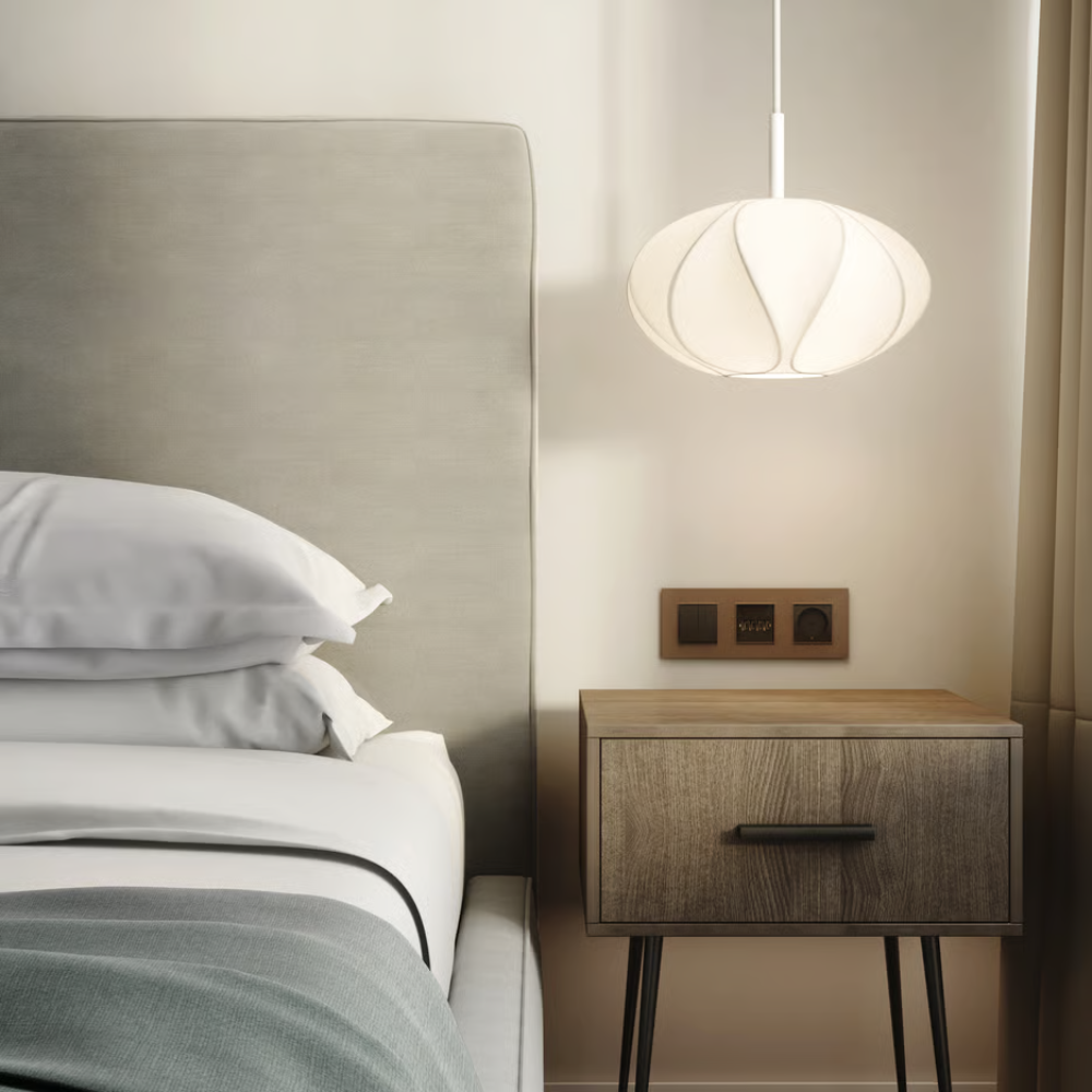 The medium Flow Pendant from Astro Lighting with the matte white base in a primary bedroom.