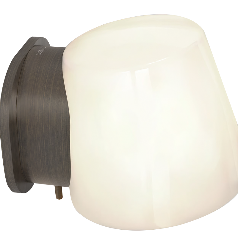 The Imari Wall Lamp from Astro Lighting in bronze close up with the light turned on.