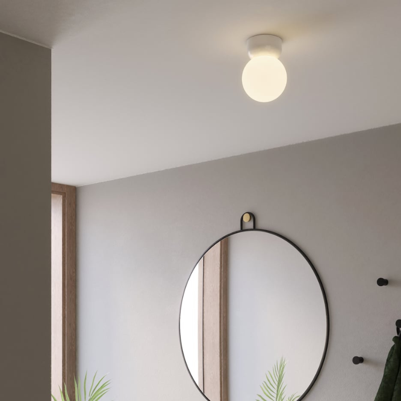 The Small Lyra Ceiling Flush Mount from Astro Lighting in an entry hallway.