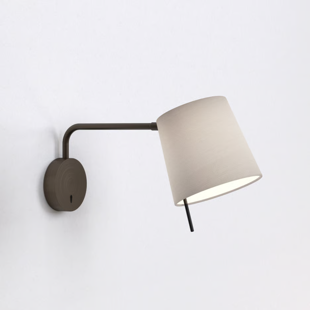 The bronze Mitsu Swing Arm Wall Sconce from Astro Lighting with the putty shade in a living area.
