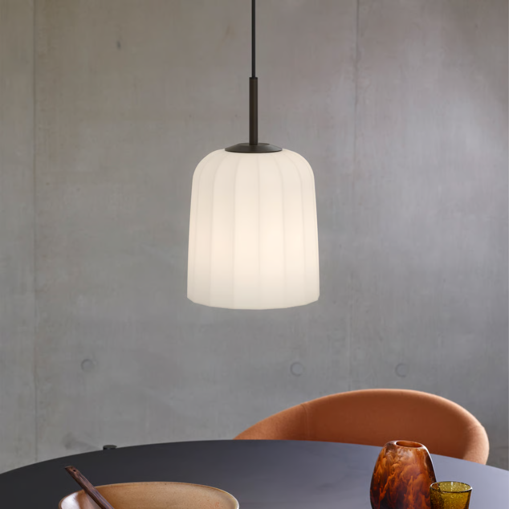 The medium Veo Pendant from Astro Lighting in a dining area.