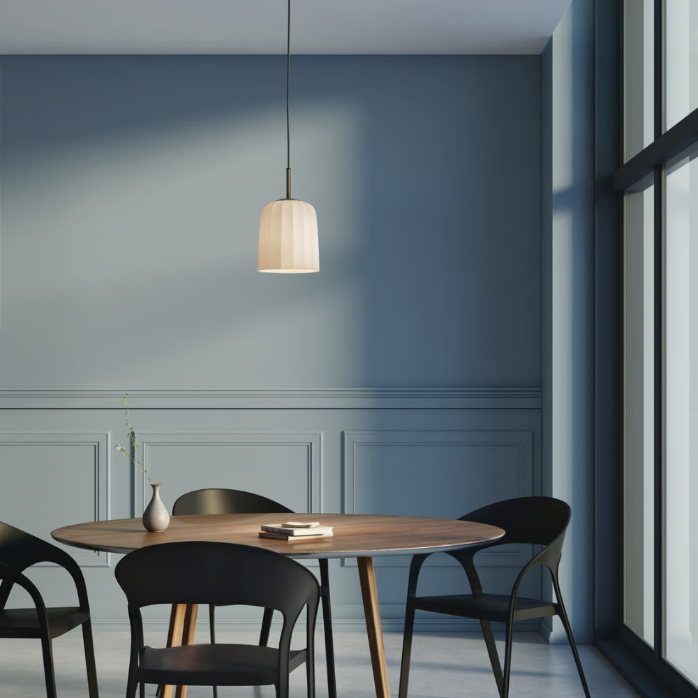 The medium Veo Pendant from Astro Lighting in a dining room.