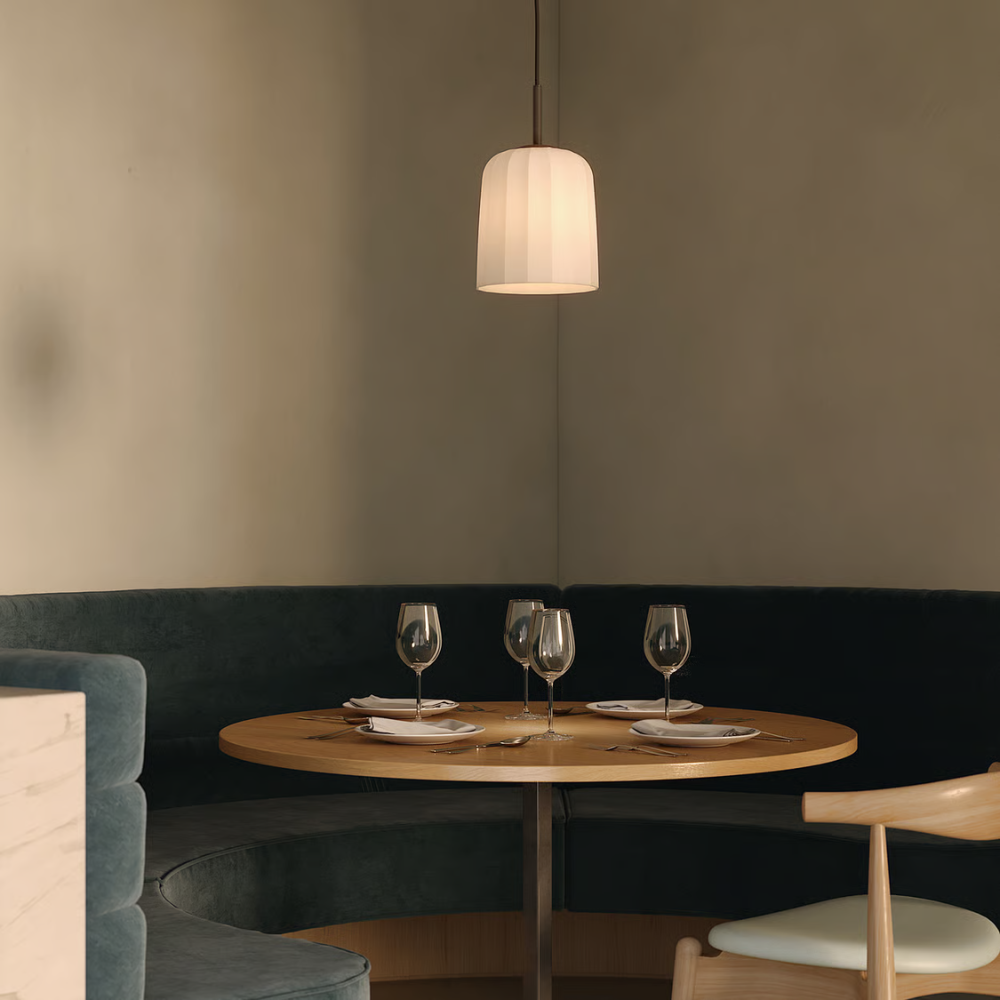The medium Veo Pendant from Astro Lighting in a dining space.