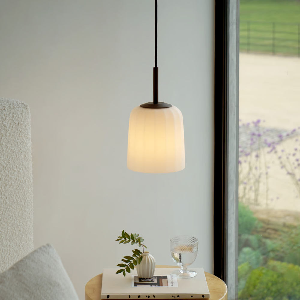 The small Veo Pendant from Astro Lighting in a designer bedroom.