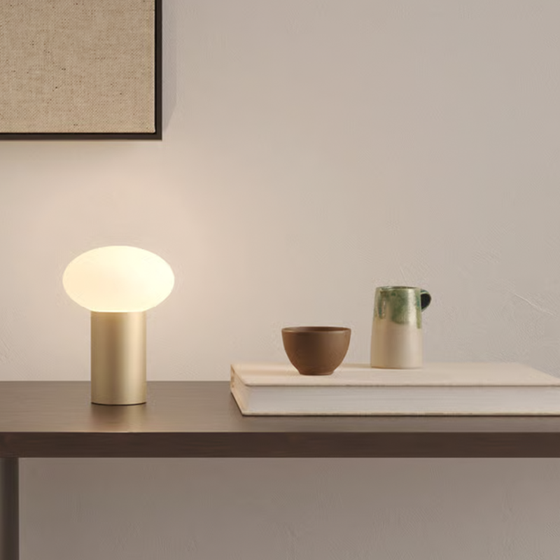 The Zeppo Portable Lamp from Astro Lighting in light bronze in an entryway.